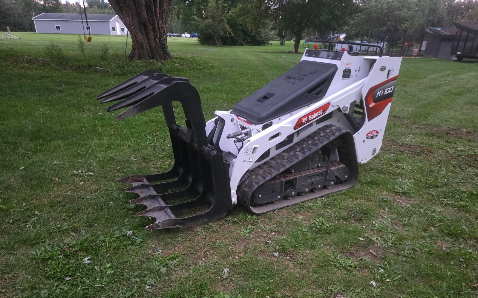 Log grapple attachment for the Bobcat MT100 at Lakeside Trailer Rental in Webster, NY